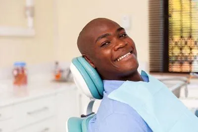 patient smiling in the dental chair at Roseville Dental Company in Roseville, CA